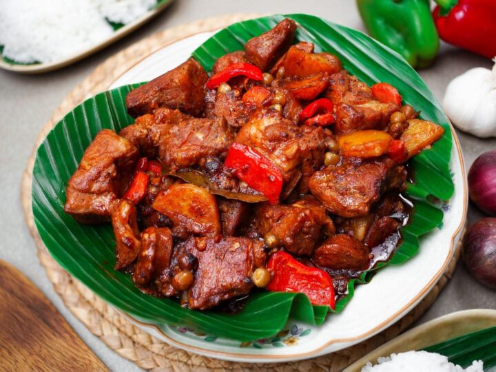 classic pork afritada recipe with potatoes and peppers