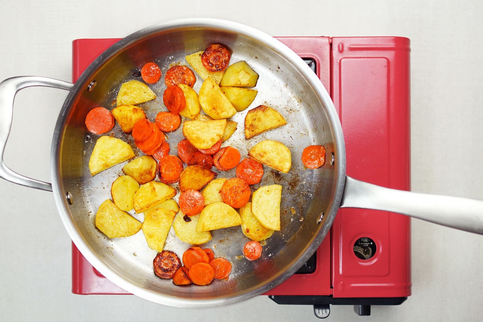 step 2 fry carrots potatoes